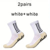 Ein Paar weiße Plus-weiße rutschfeste Sportsocken von der Seite