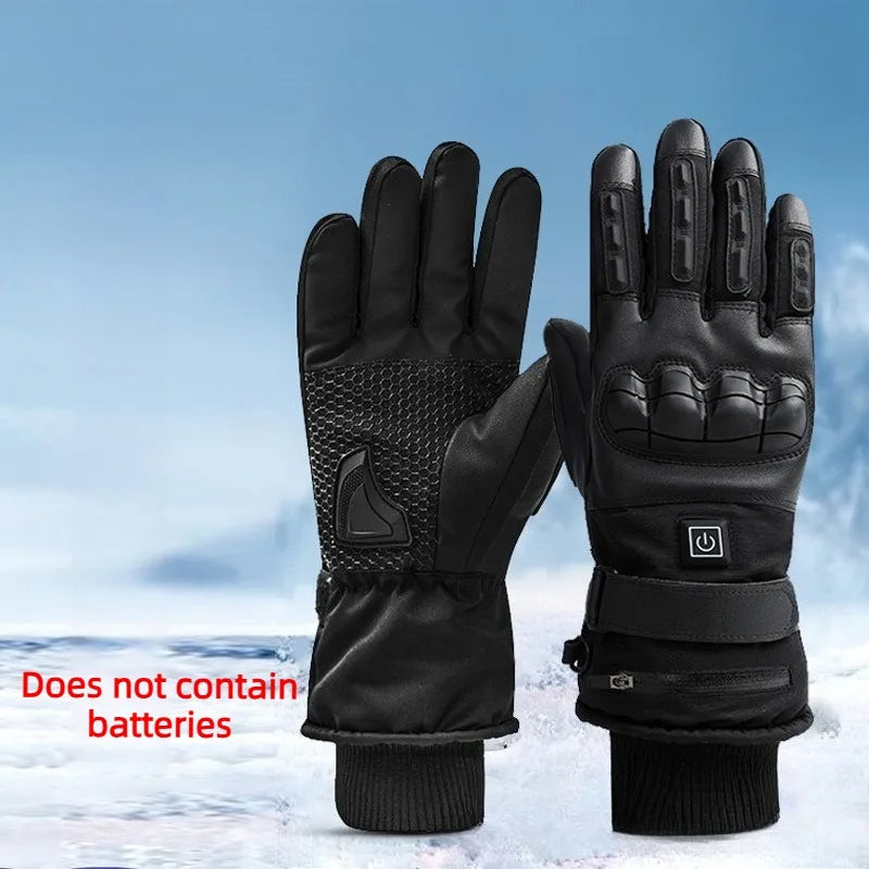 A pair of black heated thermal gloves lying on a snowy surface.