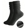 A set of three black silicone Pilates and yoga socks shown from the side.