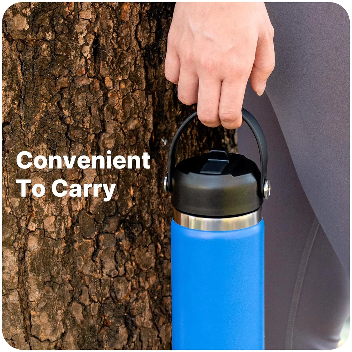 A hand holds a blue wide mouth bottle with a black straw lid against a tree trunk, emphasizing convenience to carry.