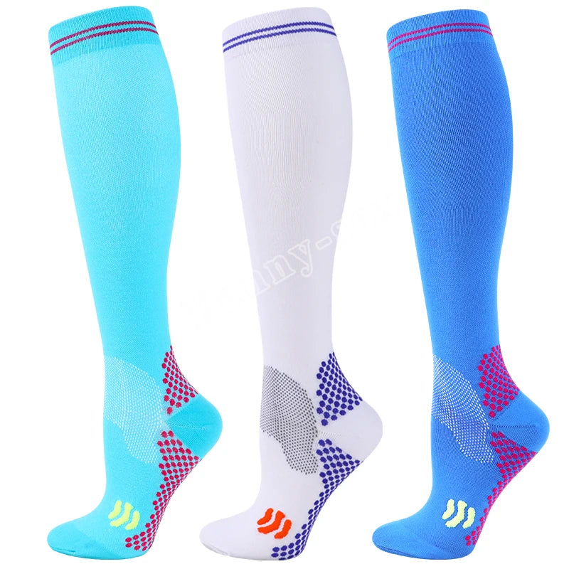 Three pairs of medical grade compression socks in blue and white with red accents shown from the side.