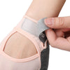 A hand is adjusting a half finger sports glove for weight lifting, showing the padded wrist strap and finger cover.