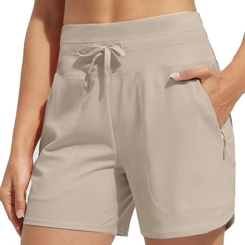Light beige high-waisted quick-dry athletic shorts with a drawstring waist