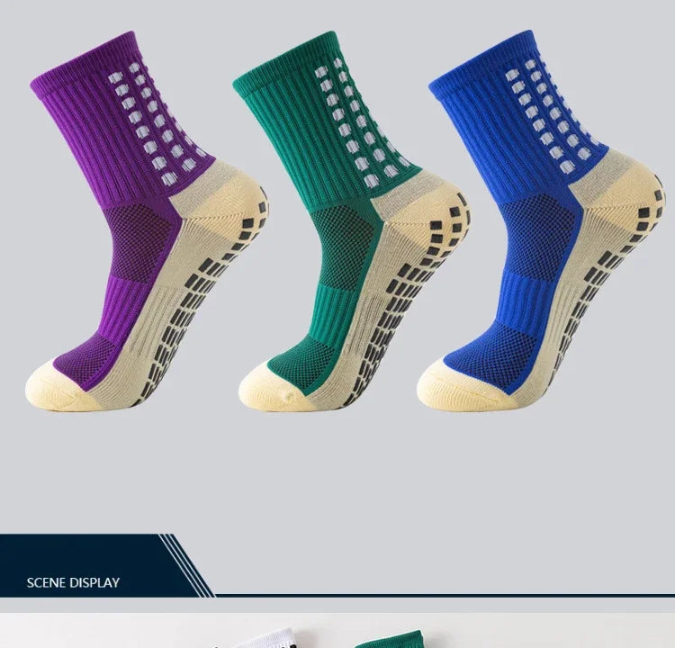 Three pairs of performance sports grip socks in purple, green, and blue with beige accents.