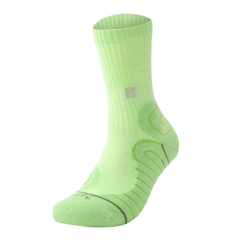 A single light green performance basketball running sock shown from the side.