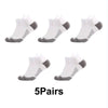 Five pairs of white performance compression sports socks shown from the foot view.