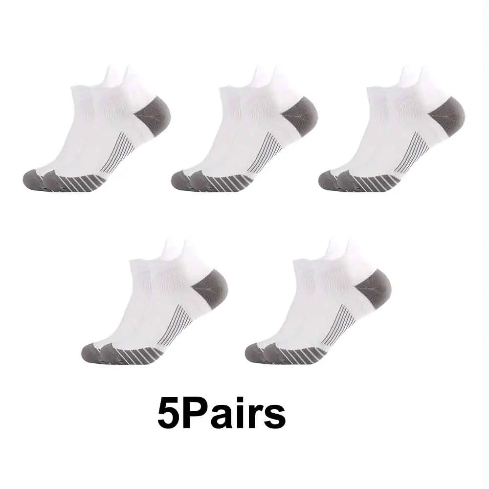Five pairs of white performance compression sports socks shown from the foot view.