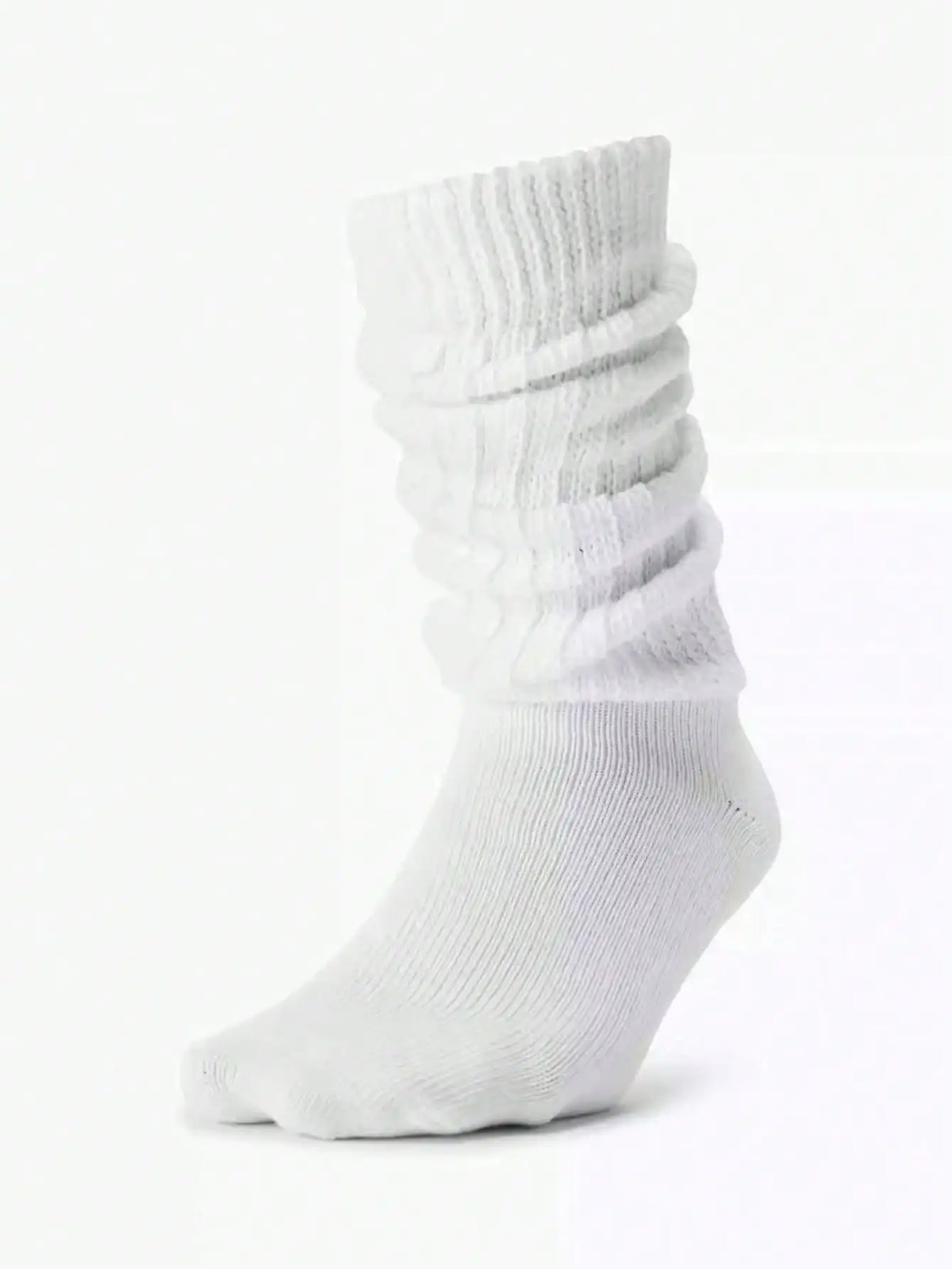 White slouch knit scrunch socks shown on a foot.