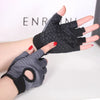 A hand wearing black and gray anti-slip fingerless gym gloves with wrist support.