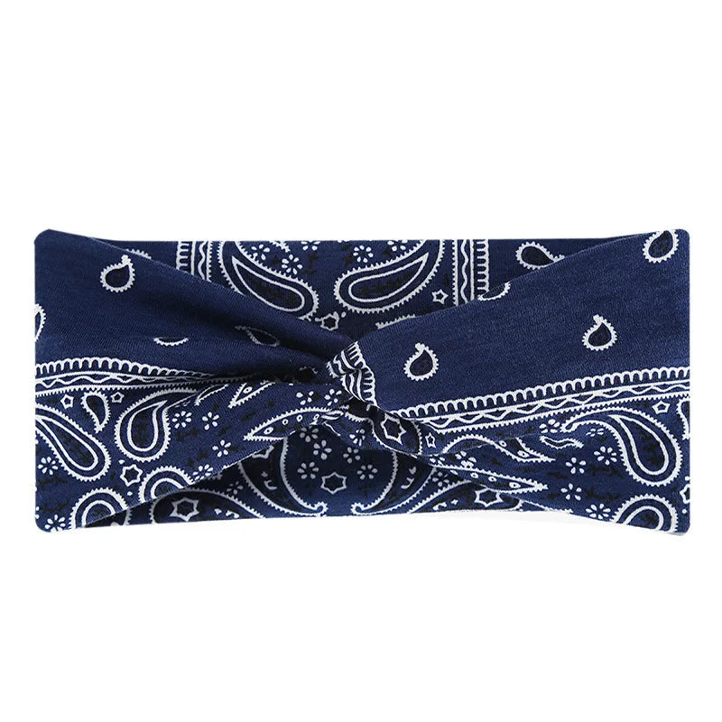 Navy blue bohemian print wide headband folded and displayed against a white background.