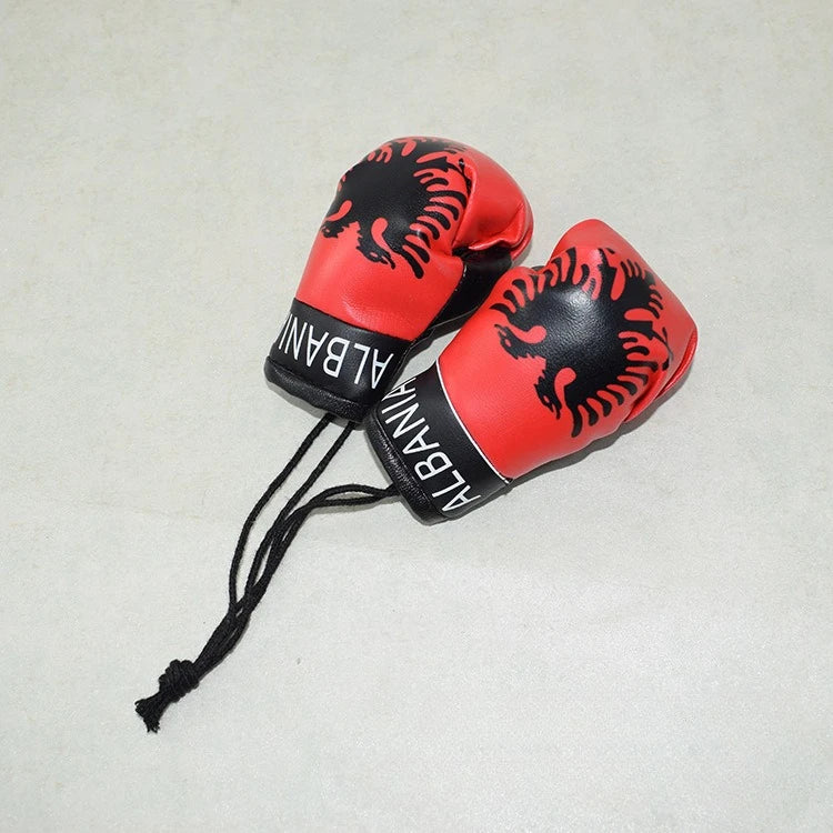Rote und schwarze Mini-PU-Leder-Boxhandschuhe als Schlüsselanhänger mit albanischer Löwen-Design