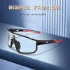 A pair of black and red photochromic sunglasses displayed against a blue striped background.