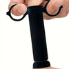 A hand is holding a black natural insect bite relief tool with curved prongs.