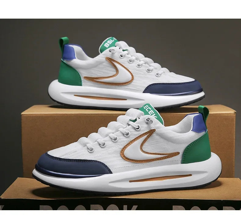 A pair of white and green men's breathable mesh running shoes are displayed on a cardboard box.
