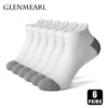 A stack of six pairs of white and gray men's cotton blend ankle socks for sports and running.