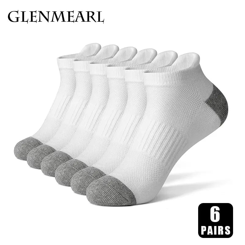 A stack of six pairs of white and gray men's cotton blend ankle socks for sports and running.