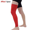 A person is wearing a red knee calf compression sleeve on their leg.