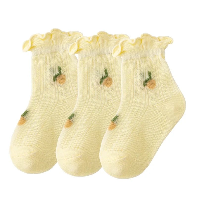 A pack of three yellow thin summer casual baby socks for kids