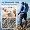 A man wearing blue outdoor gear stands on a mountain with a backpack, next to sheep and a close-up of merino wool socks.