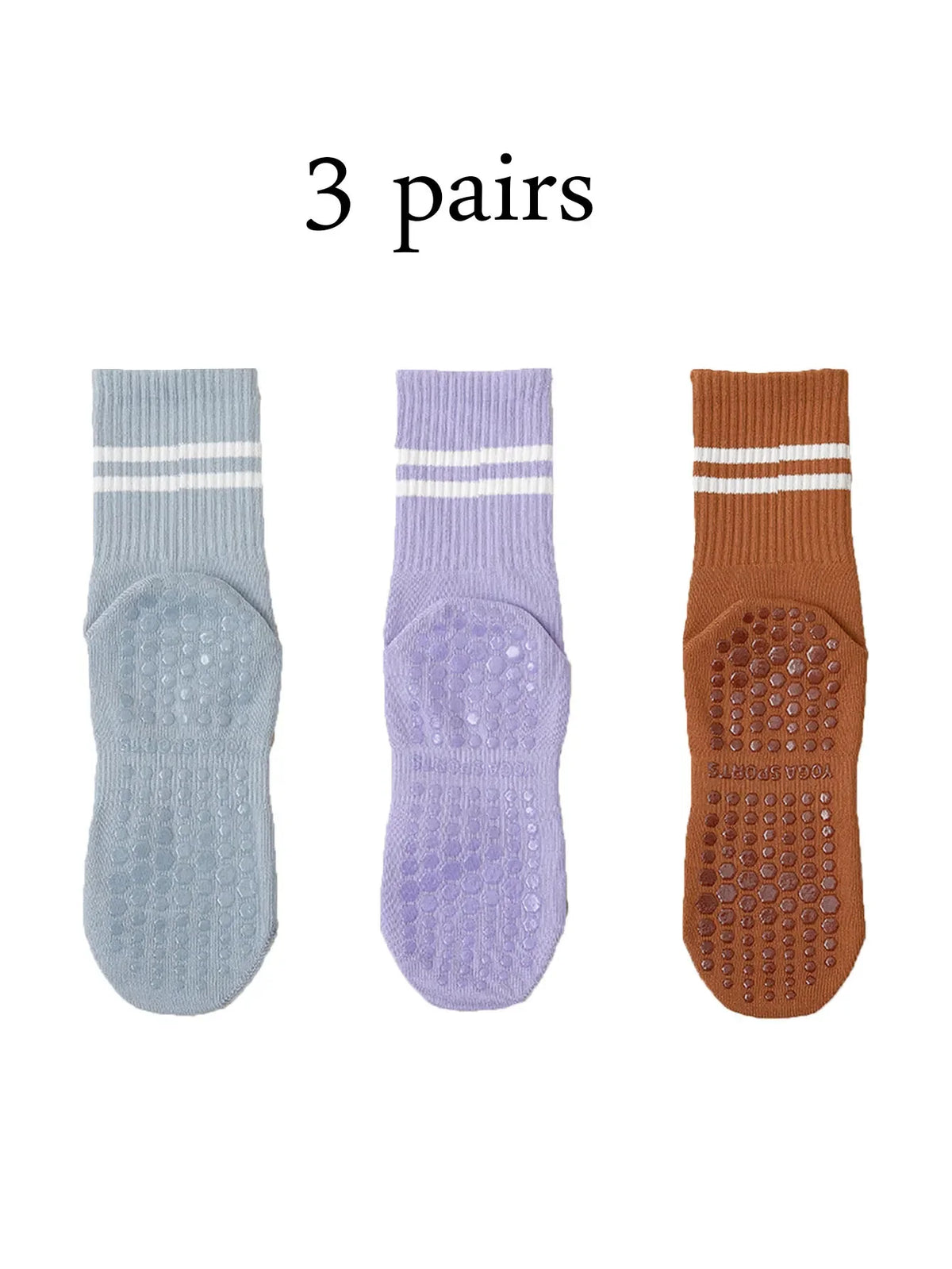 Three pairs of grip socks in light blue, purple, and brown for Pilates, yoga, and barre