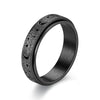 A black stainless steel ring with a textured surface featuring small moon and star designs.