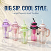 Five large capacity iced tumblers in various colors with straws and handles displayed on a light surface.