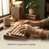 A person is typing on a wooden mechanical keyboard while wearing tan fingerless compression gloves.