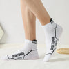White athletic socks with black text featuring the word SPORTSMAN