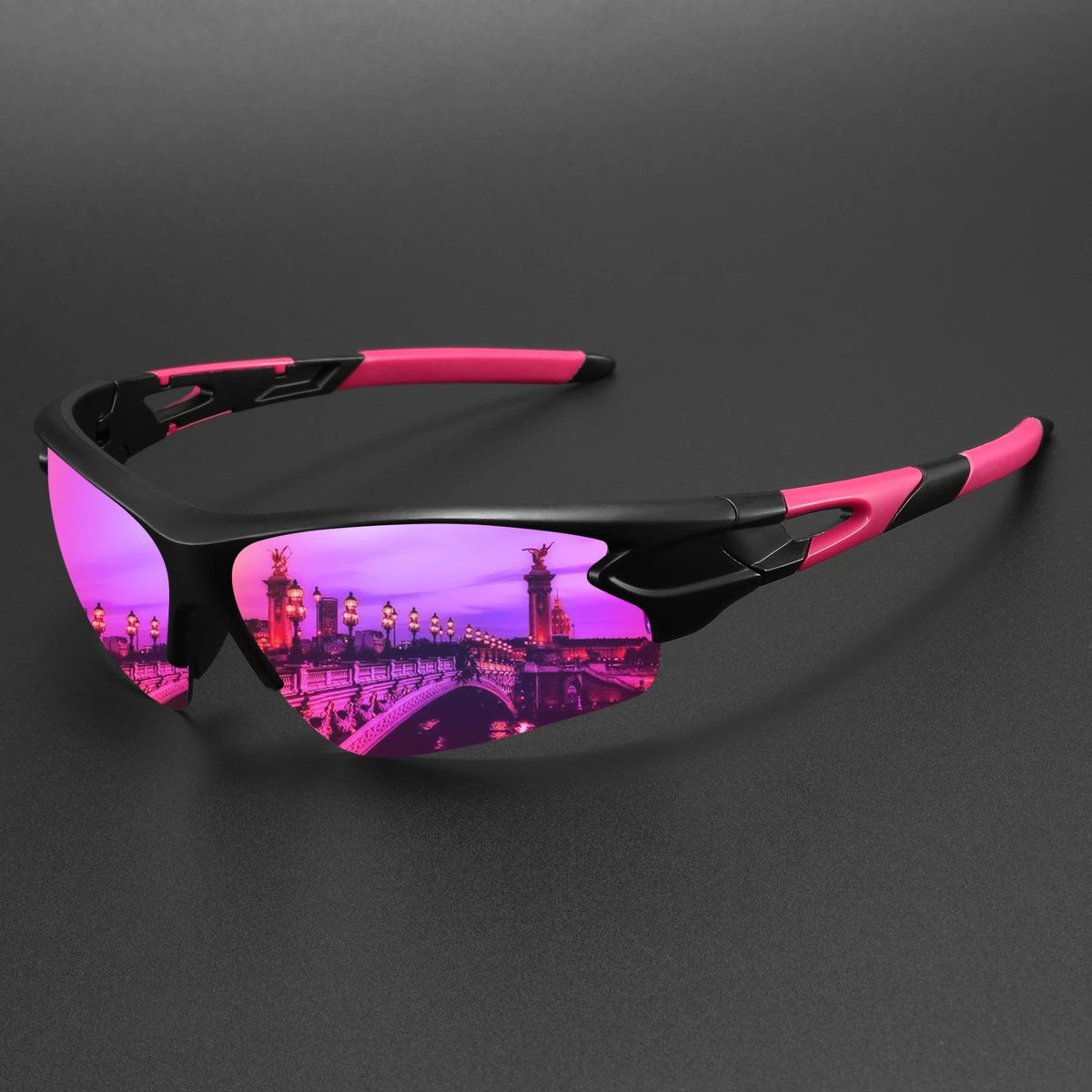 A pair of black wraparound sports sunglasses with pink accents, featuring a vibrant purple cityscape lens.