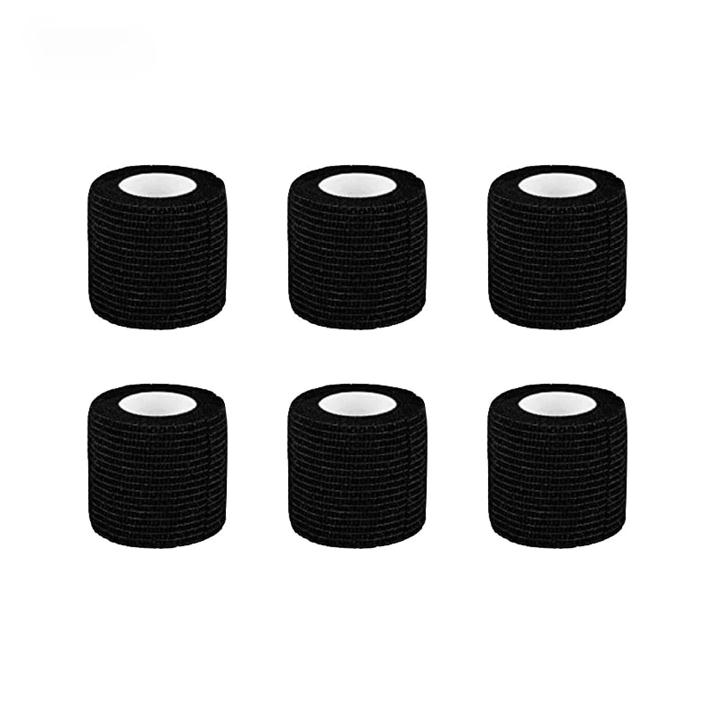 Four rolls of black tattoo grip bandage tape stacked horizontally.