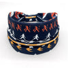 A navy blue bohemian stretch cotton headband featuring orange and white tribal-inspired patterns.