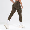 A model wearing a leopard print seamless two-piece sports set featuring leggings and a top.