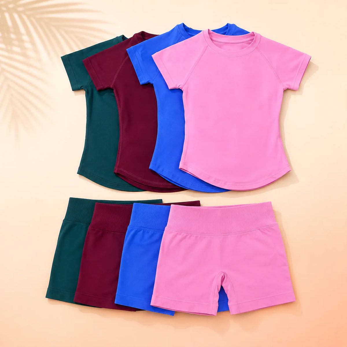 A stack of seamless high-waist yoga sets for women in various shades of pink, purple, blue, and green.
