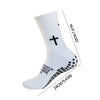 Calcetines deportivos blancos hasta la rodilla con diseño cruzado negro, mostrados de pie.