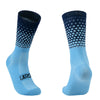 Pair of light blue compression socks with a dark patterned toe and heel