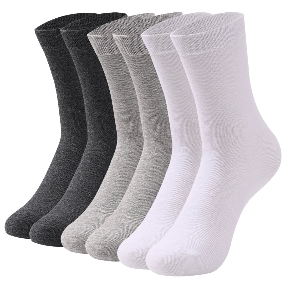 Une pile de chaussettes de coton premium en diverses nuances de gris, noir et blanc.