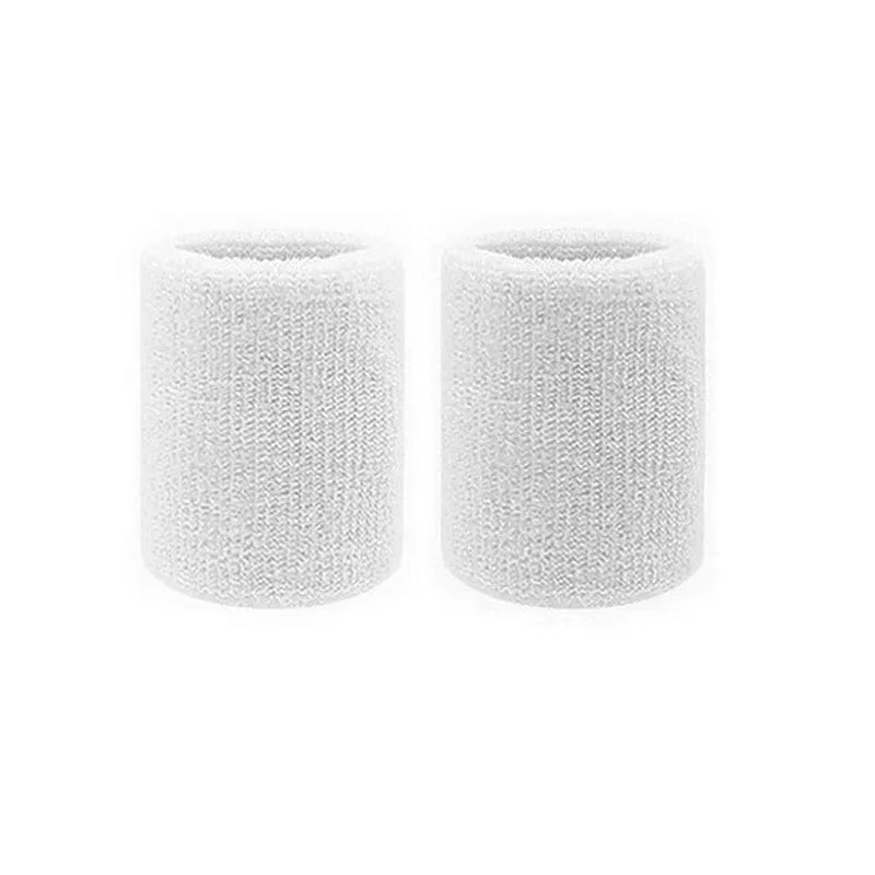 A pair of white dual sports wristbands for sweat absorption.