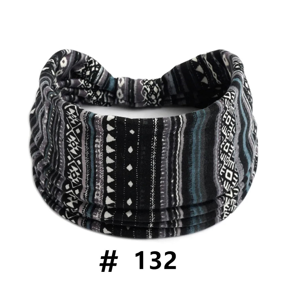 A black and gray knitted headband with a geometric pattern for yoga or workout.