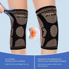 Black copper knee compression sleeve applied to a leg, showing elastic design and pressure distribution.