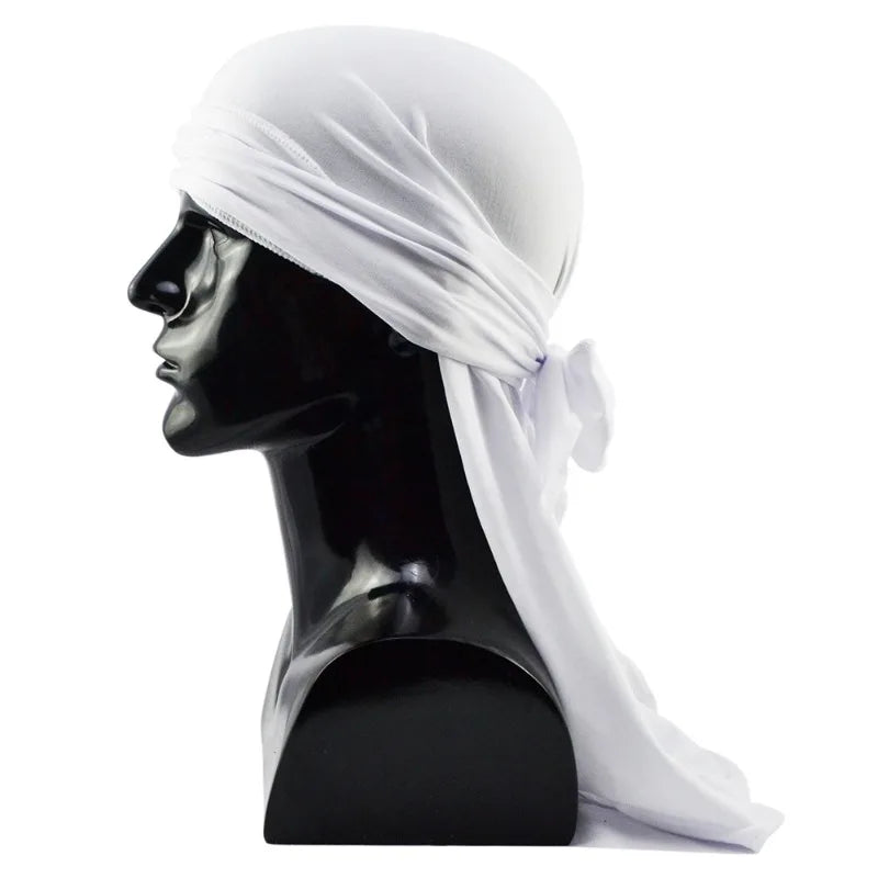 A black mannequin head wearing a white distressed pirate style durag head wrap.