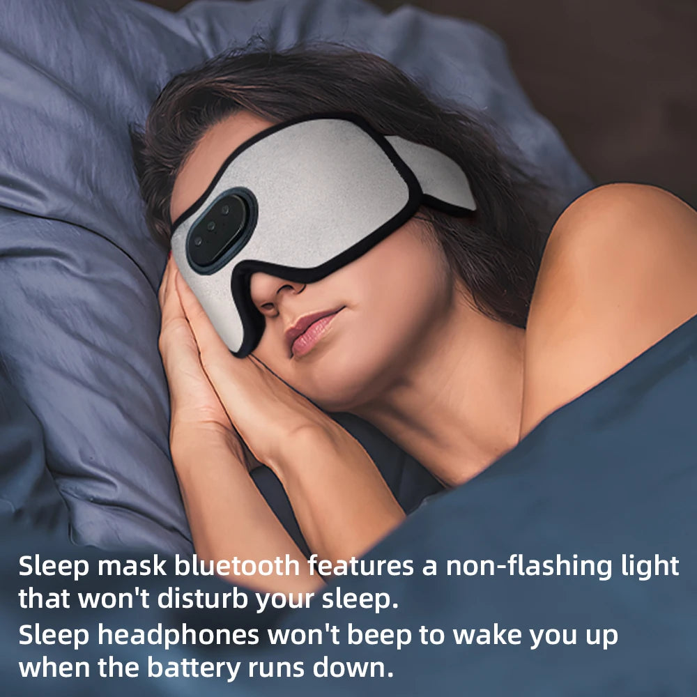 A woman is wearing a sleep mask and headphones while resting on a pillow.