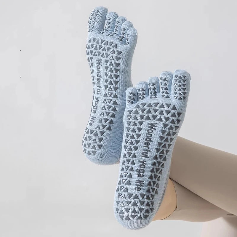 Light blue five-finger yoga socks with a geometric pattern worn on a foot.