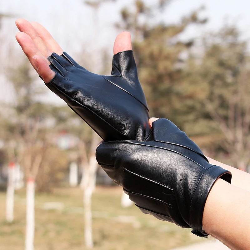 A hand wearing black PU leather fingerless fitness gloves, shown in a close-up against a blurred outdoor background.