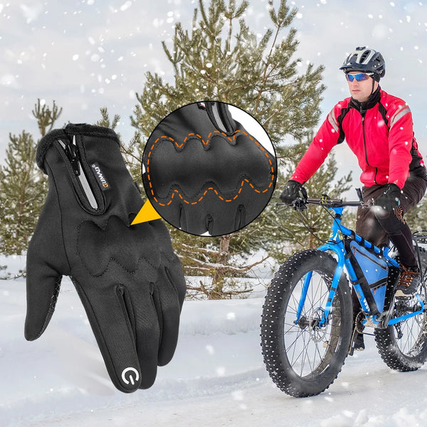 A man wearing red tactical gloves is riding a blue bicycle in a snowy outdoor setting. A close-up shows the palm design of th