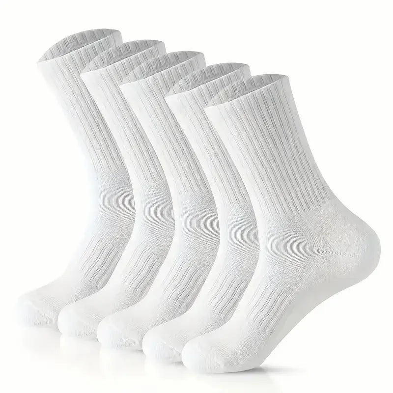 A stack of white breathable knee-high performance socks viewed from the side.