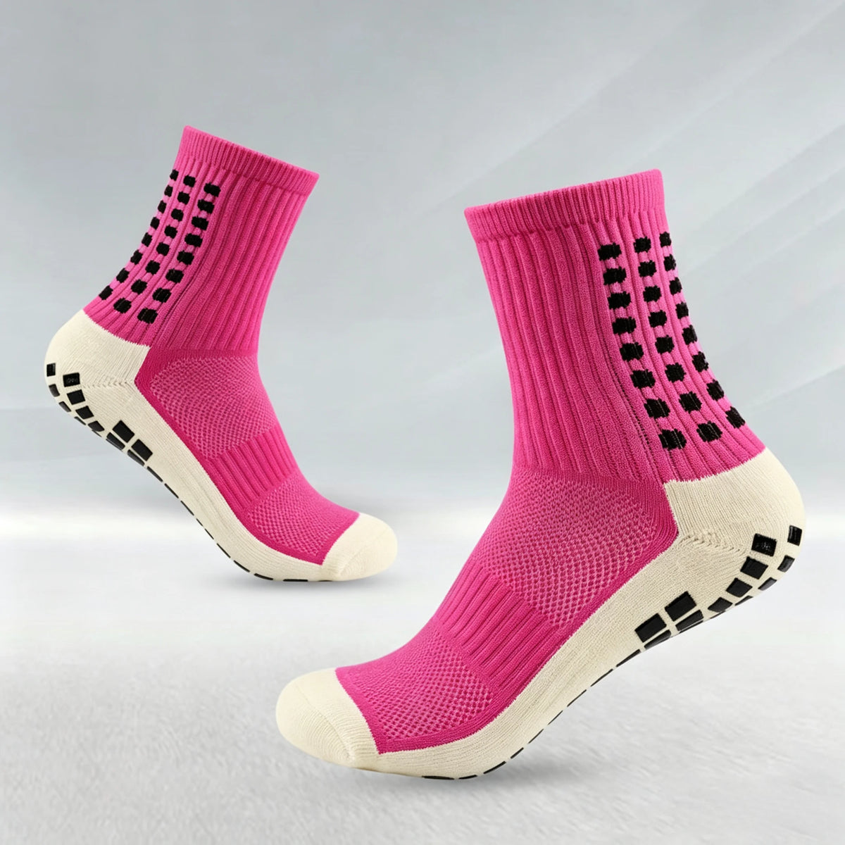Un par de calcetines deportivos para fútbol, rosas y blancos antideslizantes para hombres, vistos de perfil.