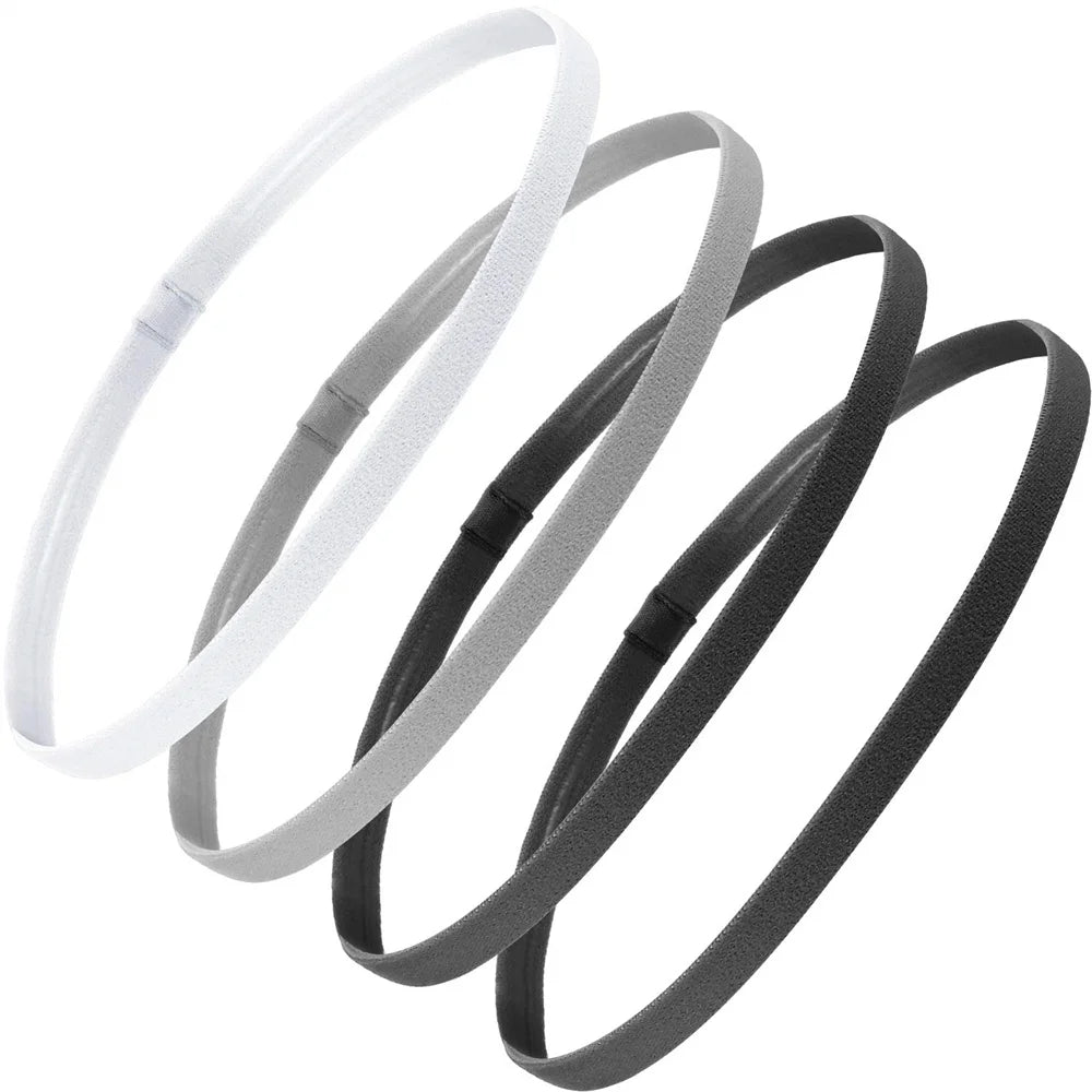Ein Set von vier weißen und grauen elastischen Sport-Headbändern in kreisförmiger Anordnung.