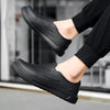 A pair of black men's anti-slip oil-resistant kitchen clogs shown from the side.