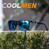 A pair of black polarized sports sunglasses resting on a mossy tree stump.
