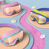 Colorful swimming goggles in pink, purple, and yellow are displayed on a light blue background.